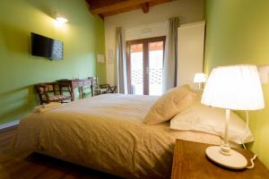 Postel nebo postele na pokoji v ubytování Albergo Diffuso Borgo Retrosi di Amatrice