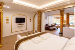 Postel nebo postele na pokoji v ubytování One Dhatu Ayutthaya Premium Homestay