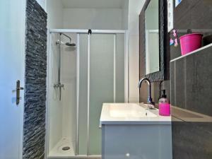 a bathroom with a sink and a shower at Apartments Soric in Omiš +42 photos