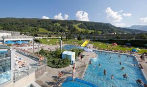 a group of people in a pool at a resort at JUFA Hotel Schladming in Schladming