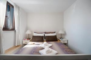 Posteľ alebo postele v izbe v ubytovaní Luxury Apartments Perko
