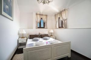 Posteľ alebo postele v izbe v ubytovaní Luxury Apartments Perko
