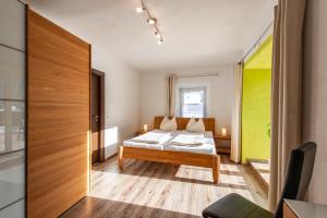 A bed or beds in a room at Appartement 103