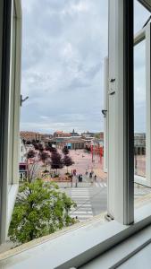 an open window with a view of a city at ApartmentInCopenhagen Apartment 1494 in Copenhagen