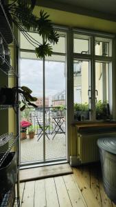 a room with a window with a view of a patio at ApartmentInCopenhagen Apartment 1494 in Copenhagen