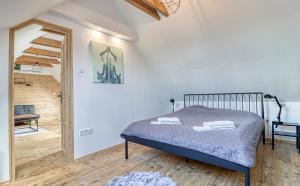 Postel nebo postele na pokoji v ubytování ZenLoft Apartman