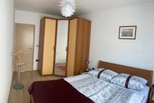 Posteľ alebo postele v izbe v ubytovaní Funtana Apartments Budinjaš