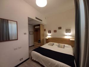 Łóżko lub łóżka w pokoju w obiekcie LH Hotel Excel Roma Montemario