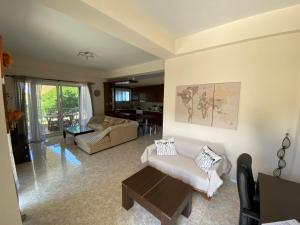 a living room with a couch and a table at Siamos Villa in Vonitsa