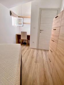 Postel nebo postele na pokoji v ubytování Golden Apartments
