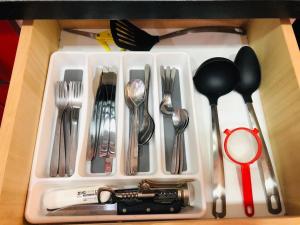 a white tray with utensils in a drawer at appartement founty Agadir in Agadir
