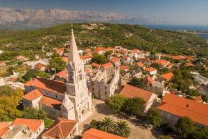 an aerial view of a town with a church at Teo's place in Selca
