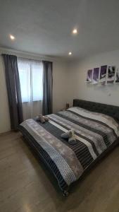 a bedroom with a large bed in a room at Teo's place in Selca +16 photos