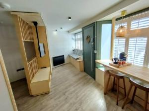 a kitchen with a counter and a table in a room at One of a Kind Luxury Studio Stay in Penzance in Penzance