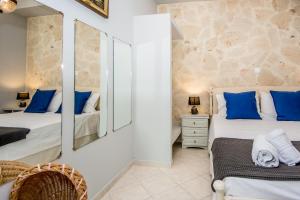 Posteľ alebo postele v izbe v ubytovaní Xenia Ionis luxury apartments