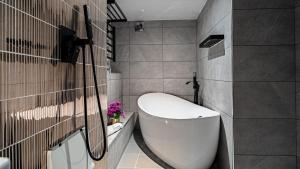 a bathroom with a white toilet and a sink at The Fisherbeck in Ambleside