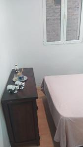 A bed or beds in a room at Apartamento 2 dormitorios cerca de Manuel Becerra