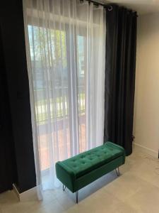 WRZOS resort & wellness **** DOMKI CAŁOROCZNE的休息区