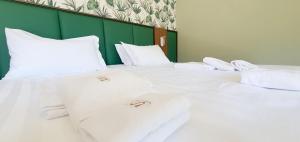 Кровать или кровати в номере Solmaris Tropea Rooms & Suites