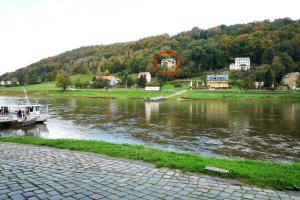 a boat in a river with a red circle at Bergapartment in Königstein an der Elbe