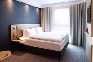 Postel nebo postele na pokoji v ubytování Holiday Inn Express Fürth by IHG