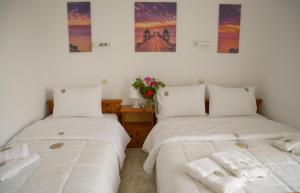 מיטה או מיטות בחדר ב-Mak Luxury Rooms