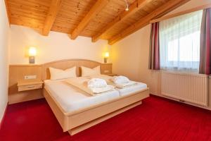 Łóżko lub łóżka w pokoju w obiekcie Appartements Olympia