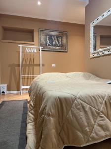 A bed or beds in a room at Villa Castello only room