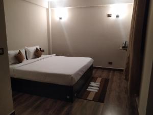 Postel nebo postele na pokoji v ubytování Joyous Rooms