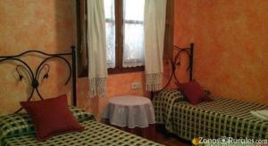 Łóżko lub łóżka w pokoju w obiekcie Casa Rural Aguascebas