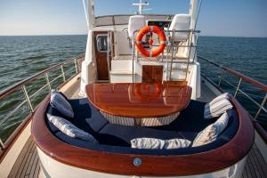 a boat with a life preserver on the deck of a boat at MSBULL in Bruinisse