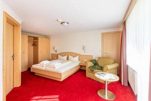 Łóżko lub łóżka w pokoju w obiekcie Appartements Olympia