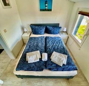 Un pat sau paturi într-o cameră la Haus Ostseeblick