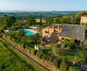 an aerial view of a house with a pool at Villa La Francigena in San Gimignano
