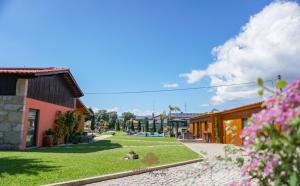a street in a town with houses and flowers at Quercia Houses in Viana do Castelo in Viana do Castelo