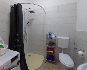 a bathroom with a shower with a toilet and a sink at ON BOARD in Piran +10 photos