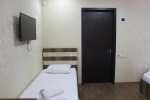 Postel nebo postele na pokoji v ubytování Hotel Lion