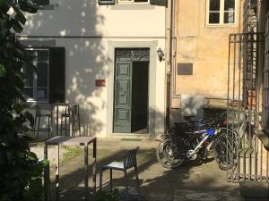 a bicycle parked in front of a building at Corte Meraviglia - Relais in Lucca