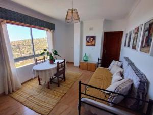 a living room with a couch and a table at Casa Arte de Sorvilan in Sorvilán