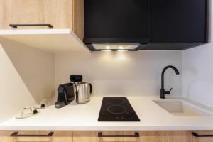 Kuchyň nebo kuchyňský kout v ubytování Kentro Luxury Suites