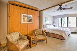 a bedroom with a bed and a chair at Crested Butte Studio with Community Hot Tub and Pool! in Crested Butte +24 photos