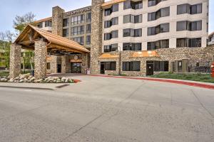 an empty street in front of a building at Crested Butte Studio with Community Hot Tub and Pool! in Crested Butte