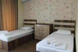 Postel nebo postele na pokoji v ubytování Hotel Lion
