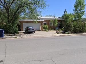 a house with a car parked in the driveway at Studio apartment 15 minute walk to plaza in Santa Fe