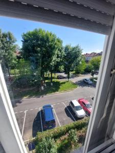 a view from a window of a parking lot at Apartament Dabe Hd in Hunedoara