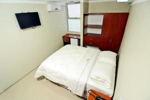 Postel nebo postele na pokoji v ubytování Hotel Plaza Sullana