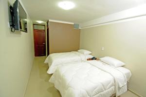 Postel nebo postele na pokoji v ubytování Hotel Plaza Sullana