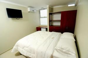 Postel nebo postele na pokoji v ubytování Hotel Plaza Sullana
