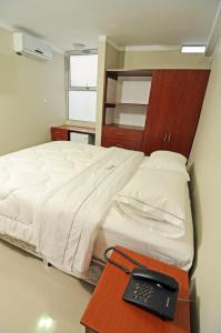 Postel nebo postele na pokoji v ubytování Hotel Plaza Sullana