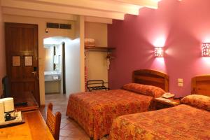 Voodi või voodid majutusasutuse Hotel Casa Conzatti toas